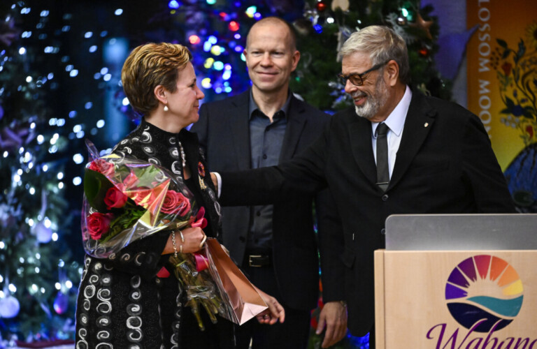 Dr. Hodges, centre and Dr. Reznick, right, present a gift to Dr. Moffatt-Bruce at a Royal College Council reception in December 2022.
